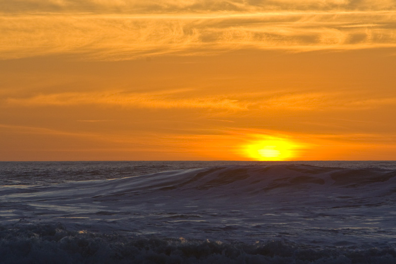 Sun Setting Behind Waves